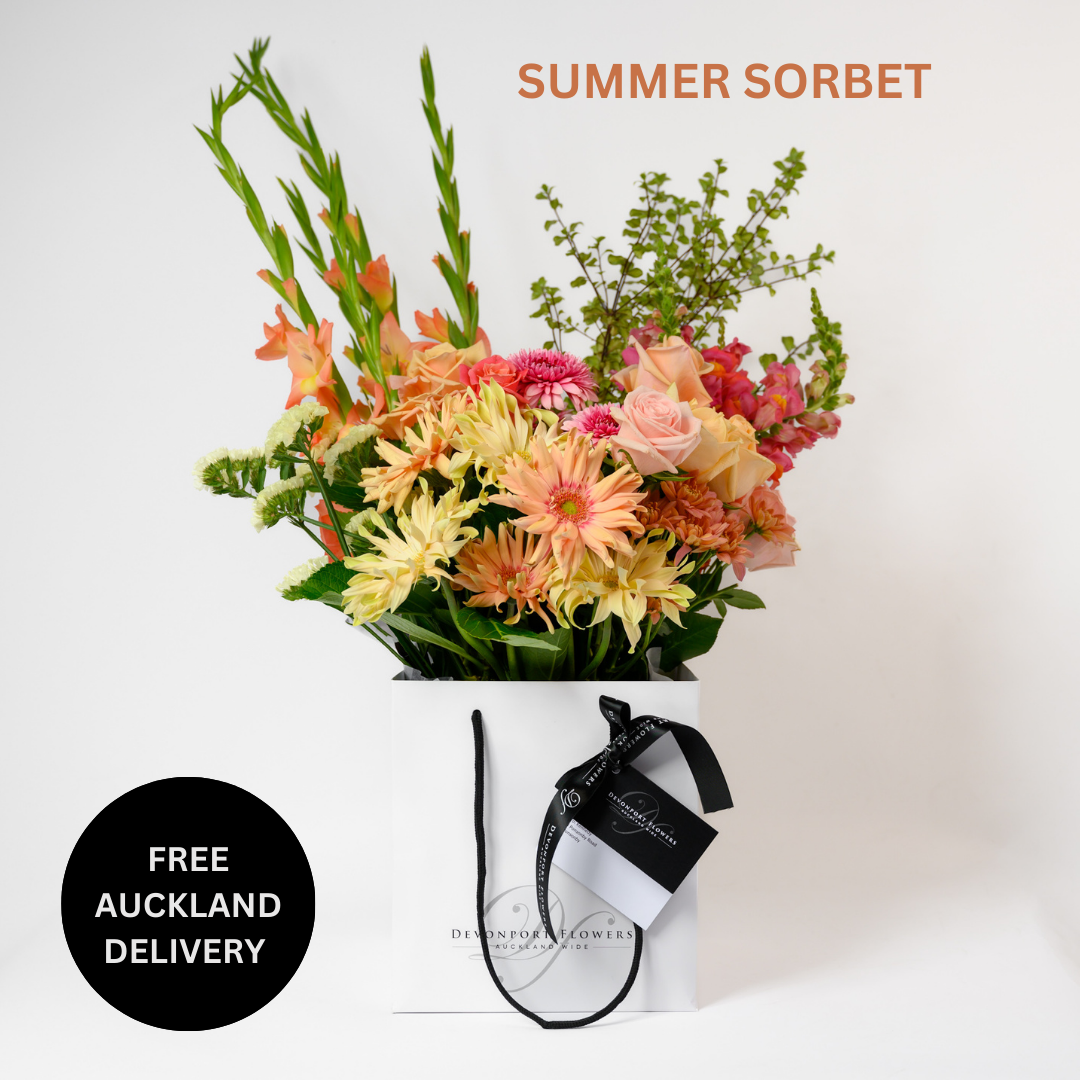 The Summer Sorbet bouquet is an exquisite blend of nature's most vibrant and refreshing colors, designed to evoke the sweet, cool delights of summer.