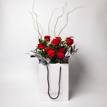 The classic and simply stunning premium red roses, spiralled with our lush greenery is ready to delight. Available in half and one dozen with several beautiful presentation options. 