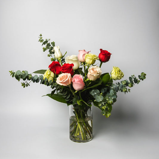 The classic and simply stunning premium mixed roses, spiralled with our lush greenery is ready to delight. Available in half and one dozen with several beautiful presentation options.