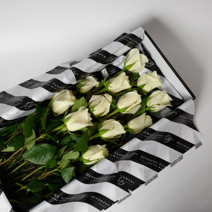 One dozen premium grade roses available in several different stunning colour options. Every stem has its own water supply helping to keep the roses fresh during transport. Beautifully presented in a black box.