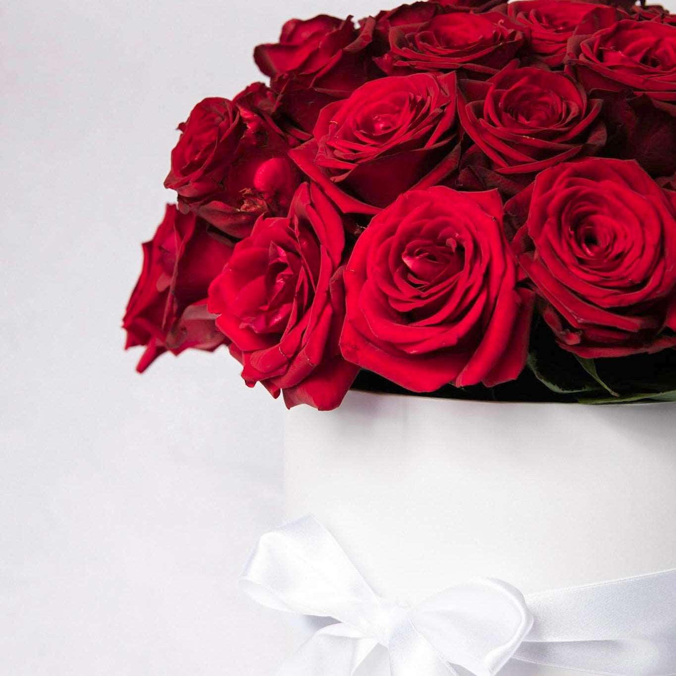These stunning red roses are presented in a gorgeous white or black hat box or a glass vase and embodies romance. Made of our freshest, most premium roses, this is the perfect romantic gesture for that special someone in your life.