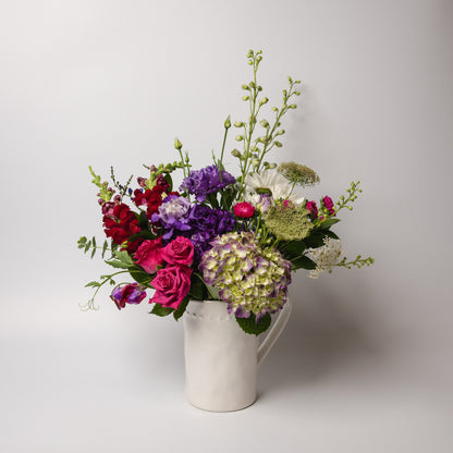 This contemporary wildflower themed bouquet of our best fresh seasonal flowers styled in a white ceramic jug. Delivered in a gorgeous Devonport Flowers box bag encased in tissue and tied with ribbon.