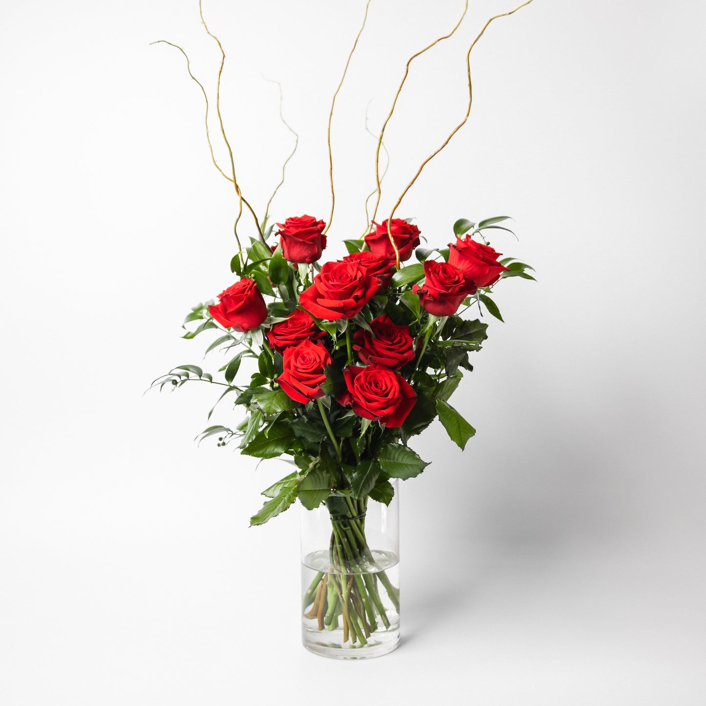 The classic and simply stunning premium red roses, complimented with seasonal greenery is ready to delight. Available in half and one dozen with beautiful presentation options, arranged in water.