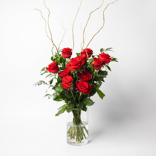 The classic and simply stunning premium red roses, complimented with seasonal greenery is ready to delight. Available in half and one dozen with beautiful presentation options, arranged in water.