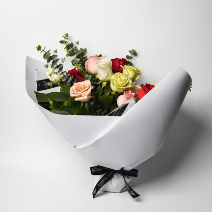 The classic and simply stunning premium mixed roses, spiralled with our lush greenery is ready to delight. Available in half and one dozen with several beautiful presentation options. 