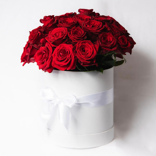 These stunning red roses are presented in a gorgeous white or black hat box or a glass vase and embodies romance. Made of our freshest, most premium roses, this is the perfect romantic gesture for that special someone in your life. 